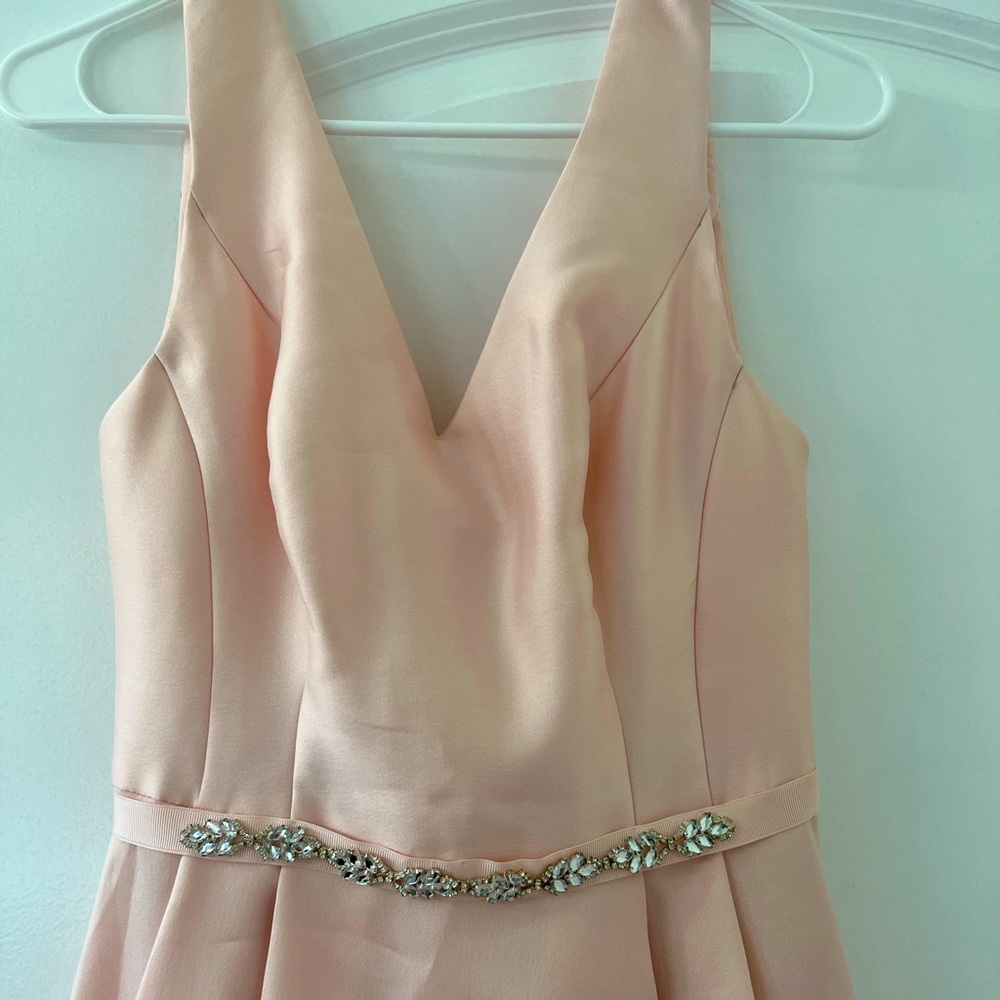 Light pink midi formal dress. Perfect for homecoming or a wedding.